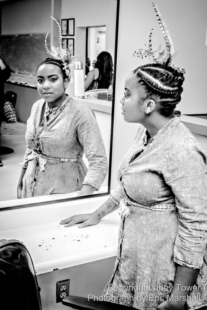 Michelle Conway poses in front of a mirror before the showcase at Laney College on Oct. 27.