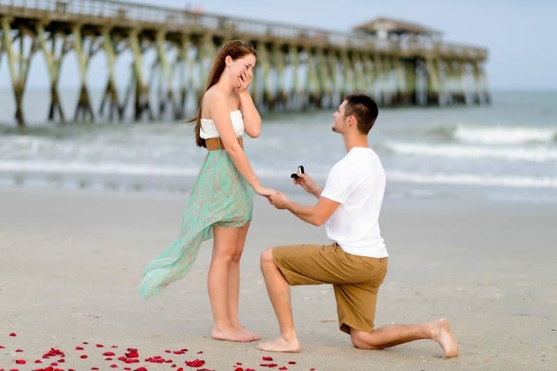 A Man proposing his lady.