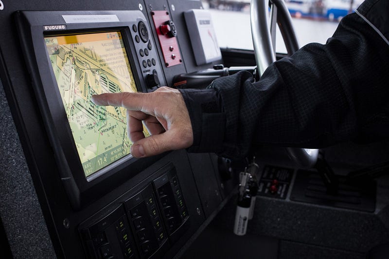 Warren Scotter, a Bellingham firefighter and member of the Salish Star crew points to Furuno NavNet 3D radar and chart plotting system used by the crew to monitor objects or humans they may be searching for in the water. 