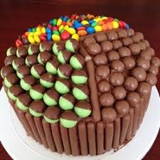 Beautifully arranged chocolate and edible stuff brown and colorful balls on surface