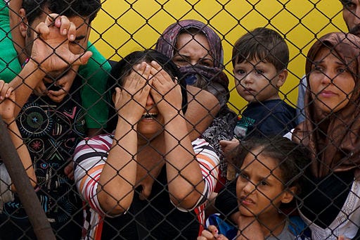Women and children among Syrian refugees striking at the platform of Budapest Keleti railway station. Refugee crisis. Budapest, Hungary, Central Europe, 4 September 2015; Mstyslav Chernov, CC BY-SA 4.0 , via Wikimedia Commons