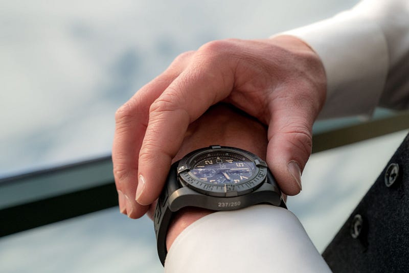 a person holding their wristwatch