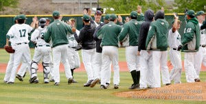 Laney College players celebrate after an 8-1 victory over Mendocino College on April 7, which broke a 17-game losing streak.