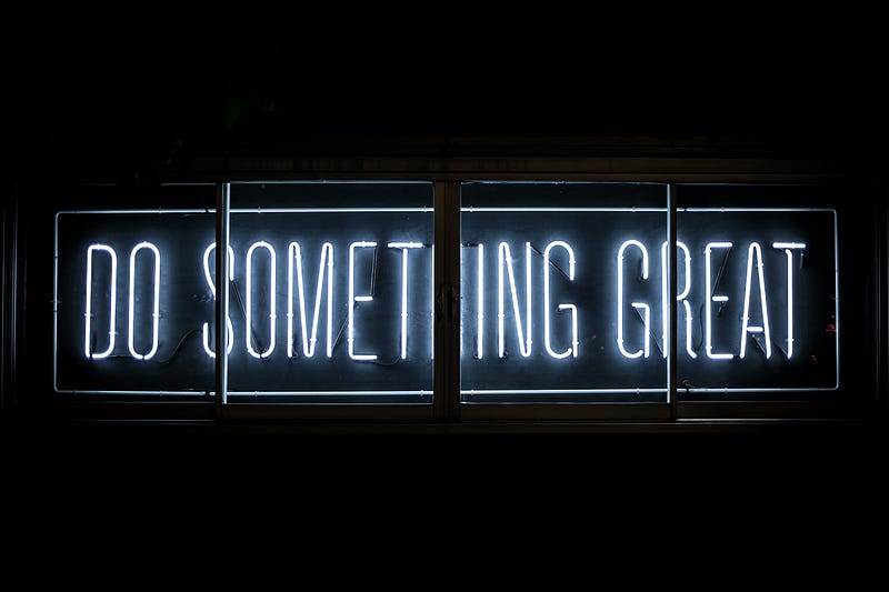 Neon sign saying "Do Something Great"