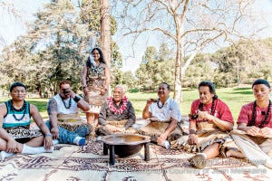 A traditional kava circle gathers in Dimond Park, Oakland.