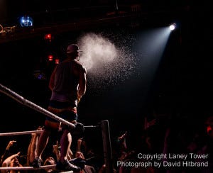 Background Photo: Broseph Joe Brody sprays a cloud of whiskey on the crowd. 