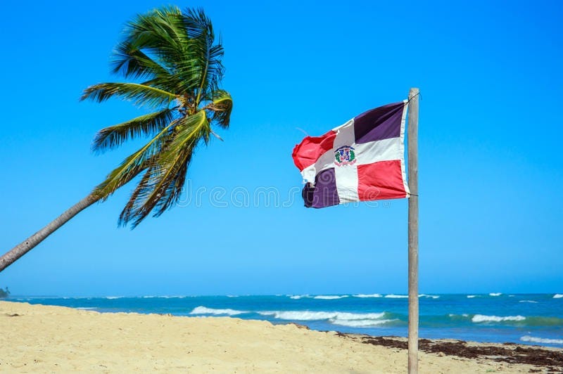 Dominican Republic Flag on a Sunny Beach