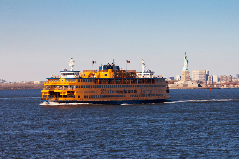 Staten Island Ferry passing by the Statue of Liberty