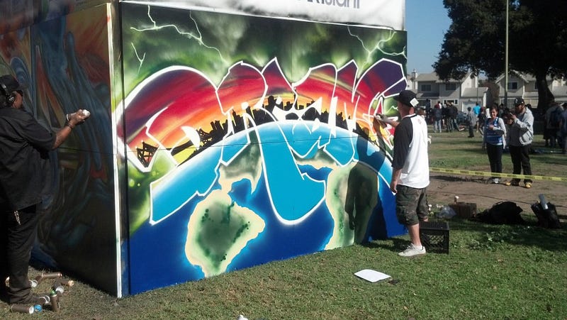 Local artists compete in the Estria Graffiti battle during the 'Life is Living' festivities at DeFremery Park.
