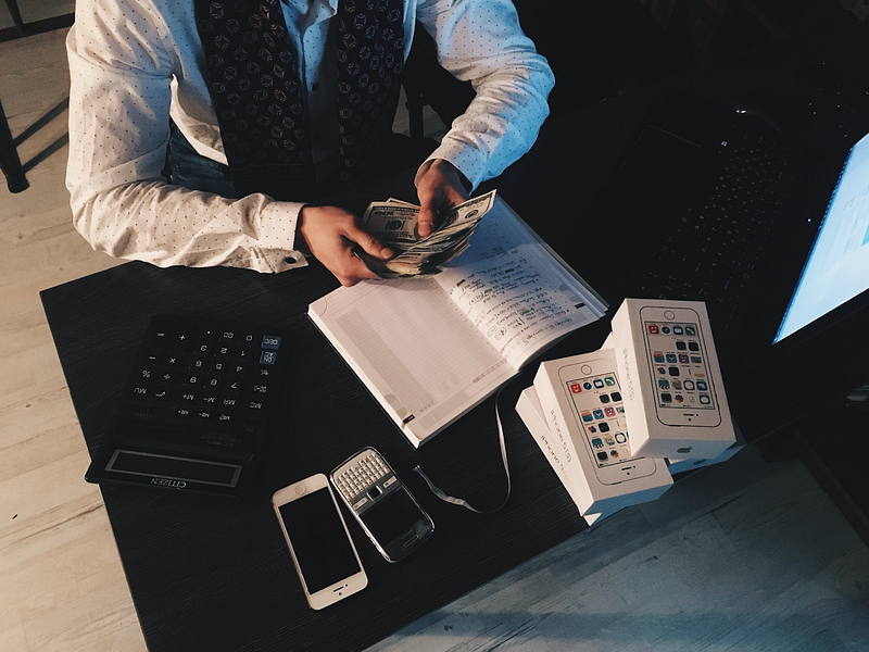 Man counting paper bills