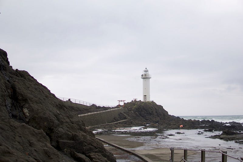 A lighthouse on the edge of a craggy rock in Nezugaseki, a tiny fishing village along the Sea of Japan near Mt. Nihonkoku, one of the 100 Famous Mountains of Yamagata in Tohoku, north Japan