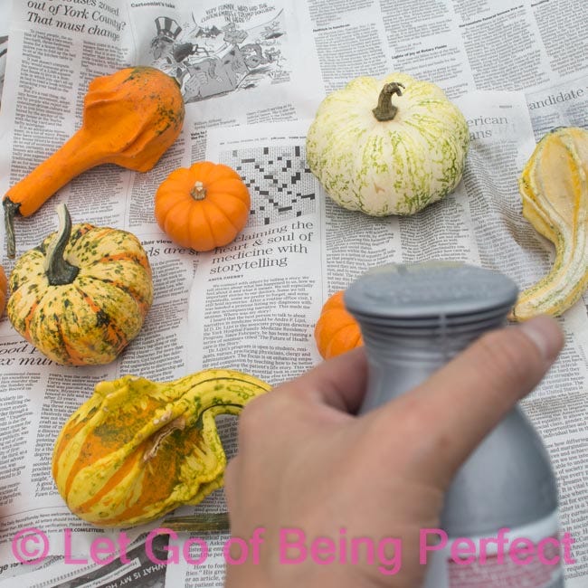 Make a simple Thanksgiving centerpiece! painted gourds are super simple & makes a lovely home decoration. Paint different colors to change up your decor, or for different parts of the house.
