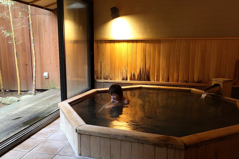 A Japanese child enjoys a relaxing soak