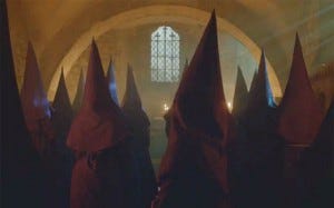 The cult-like suffragettes, wearing KKK-style hoods
