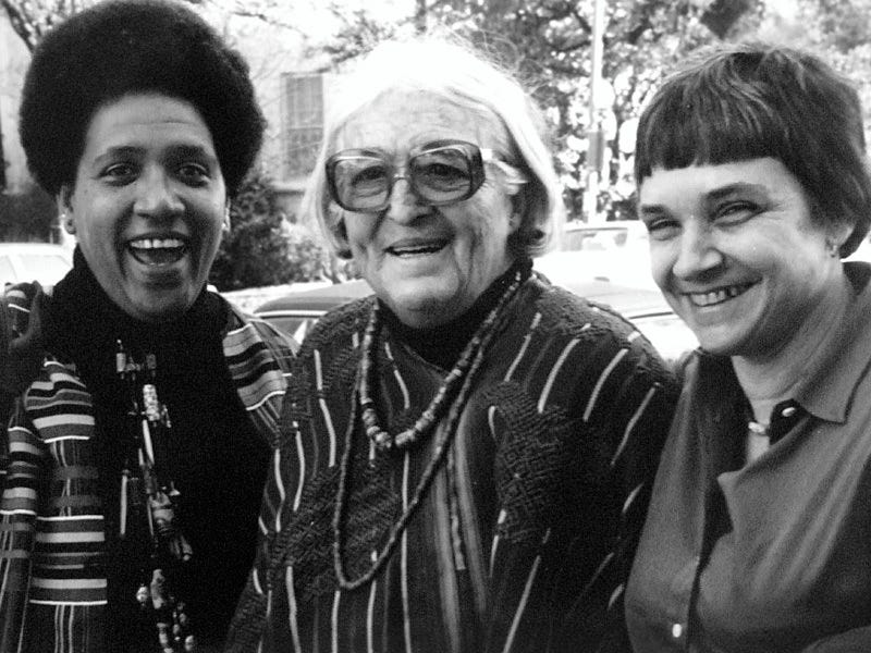 Picture of three writers. Audre Lorde (left), Meridel Le Sueur (middle), and Adrienne Rich (right) during the Austin, Texas writing workshop in 1980.