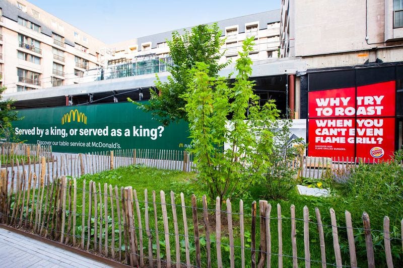 Buger King sign ad in response to McDonald’s in Belgium — Brand rivalry and marketing competition, advertising war.