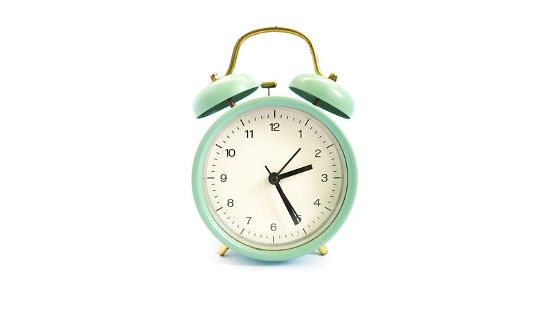An alarm clock signifying breakfast time and eating less