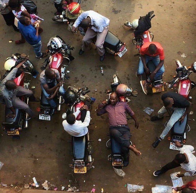 Men at a boda stage. Credit: unknown, still looking.