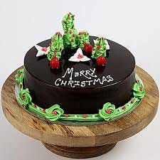 Base made of chocolate and surface covered with green edible cream with designs made with it