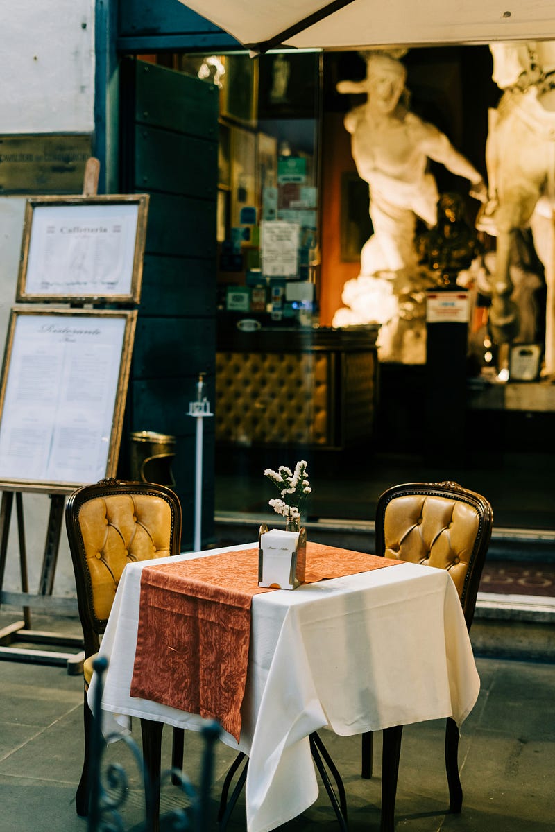 An outide dinner table for two in Rome, Italy.