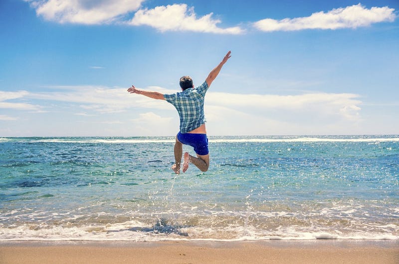 Travel and Vacation concept. Happy young man having fun outdoors. Joyful man. Summer. Holidays