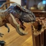Tyrannosaurus Rex figure bites into chocolate casket