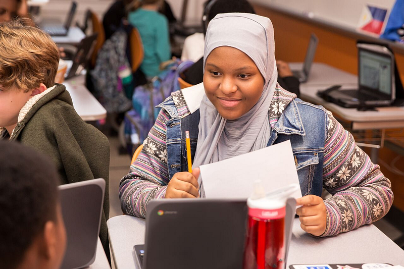 A student works on her assignment. 
