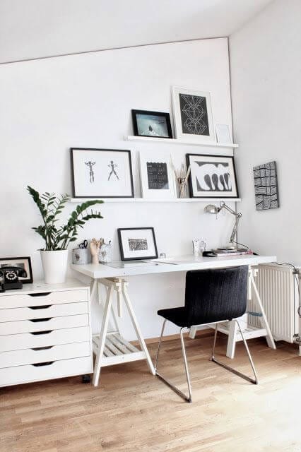 Monochrome Scandinavian office with printed frames