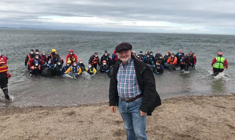 Colin Beattie and other volunteers practice what to do in case of a pilot whale stranding.