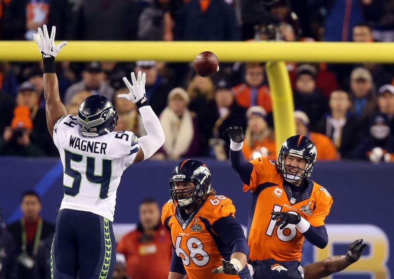 Peyton Manning throws an interception during Super Bowl XLVIII against the Seattle Seahawks.