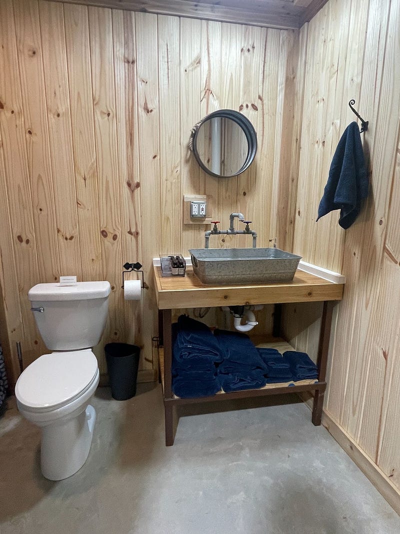 metal top sink and a mirror edged with metal