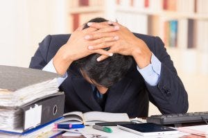 stressed business man at desk