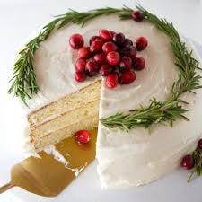 A designer cake with topper all over with red cherries