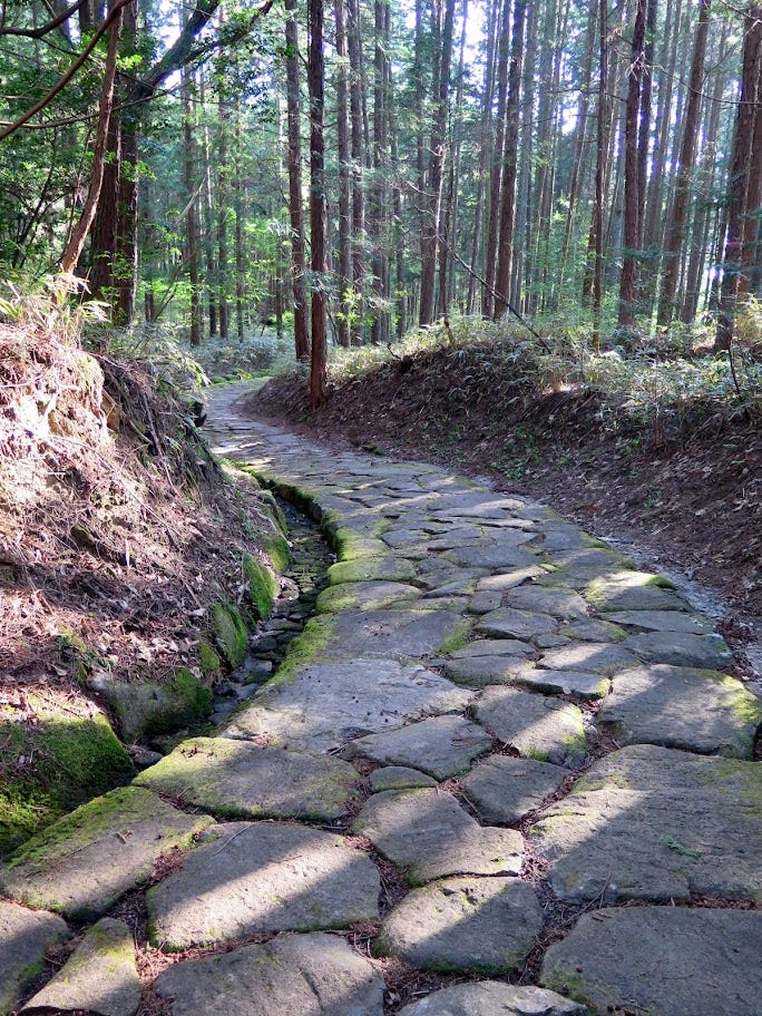 Winding cobblestone section of the Nakasendo Way.