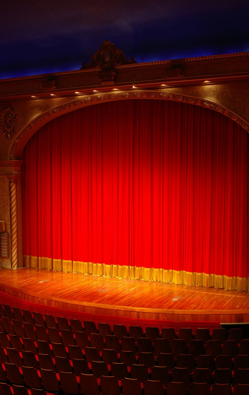 Stage with a red curtain.
