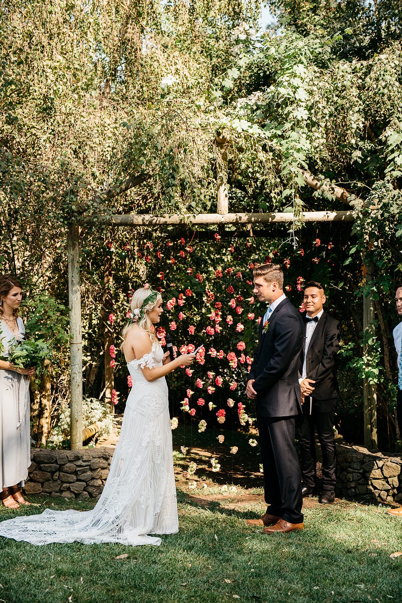 carnation garland backdrop - http://ruffledblog.com/fiesta-inspired-san-diego-wedding