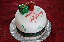 Sweets decorated like gift boxes on top in red and green color