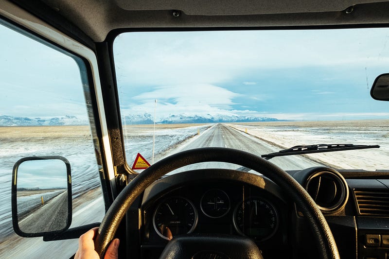 Car driving down road