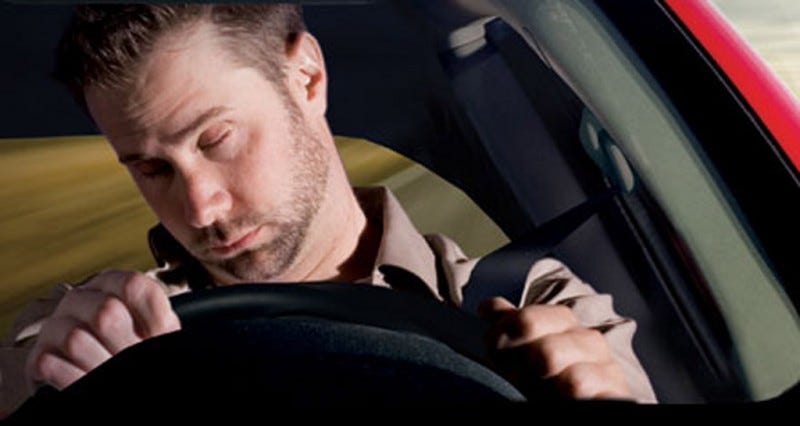 Man falling asleep at the wheel.