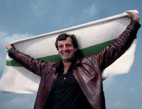 Douglas Adams holding up a towel