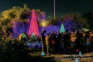 Attendees gather around an installation at the Oakland Festival of Lights at Lake Merritt.