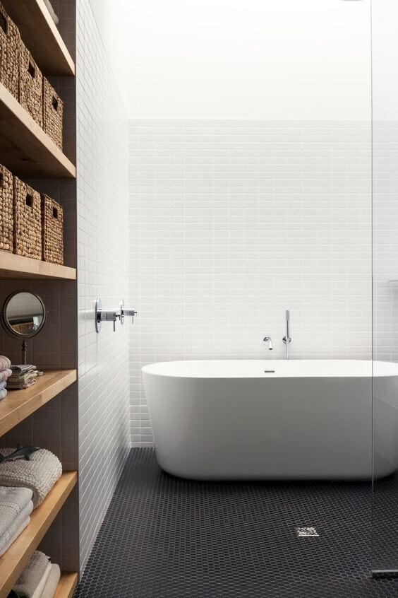 Scandinavian bathroom with white statement bath