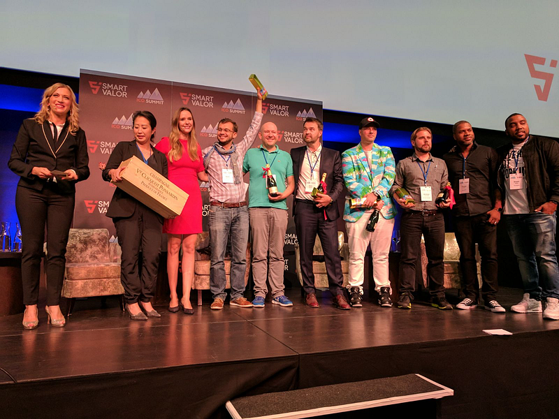 Renat Khasanshyn & Stephan Karpischek (4th & 5th from left) on stage to receive their prize at the ICO Summit (picture courtesy of Smart Valor)
