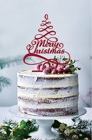 Layered and decorated in grown and white color and circular shape with edible fruits on top surface