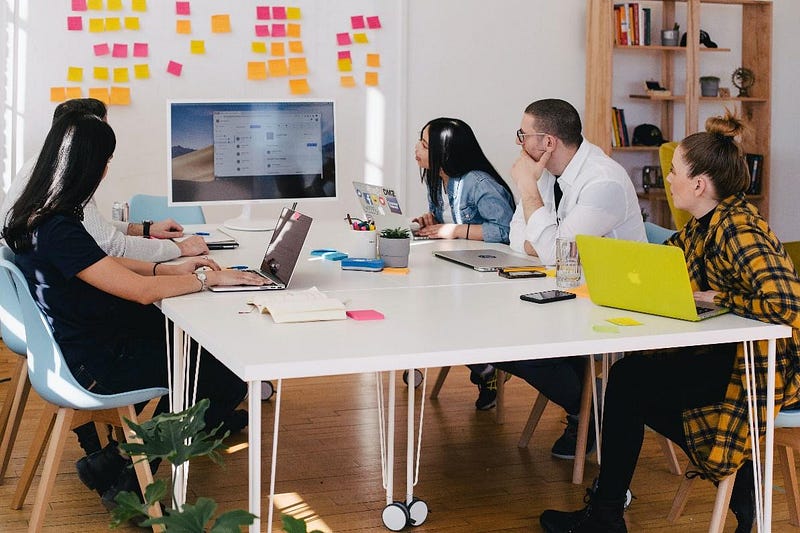 A group of people planning strategies to improve their content for digital marketing