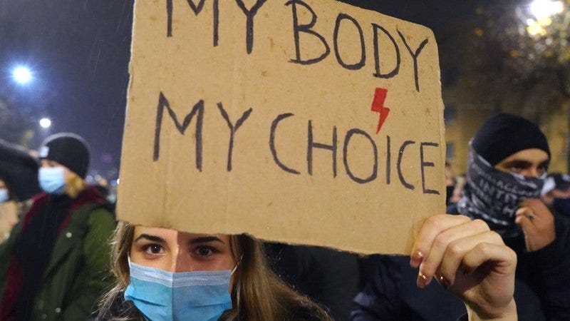 Polish protester holds “my body, my choice” sign