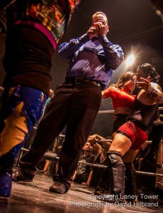 Guido the Reffree sparks up some mid match medication as Anthony Butabi bumps and grinds with Trina Michaels.