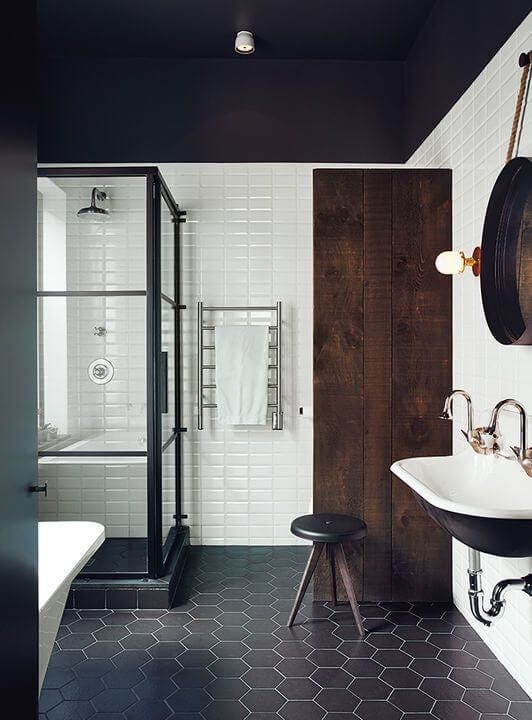 Scandinavian bathroom with dark wood and tiles