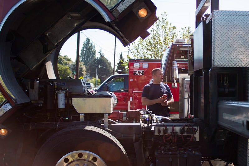 McDonald opens the cab of the ladder truck works on inspecting the engine on Saturday, May 7. On the first Saturday of each month, firefighters go through inventory, run all of the tools and equipment and inspect the trucks.