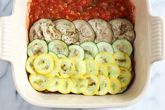 Layers of eggplant, zucchini and squash are baked in a quick tomato sauce with bell peppers and herbs then topped with Havarti cheese. This is a great tasting meatless main dish.